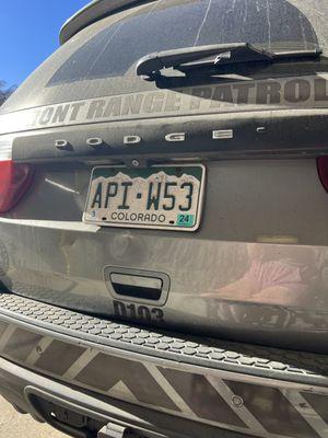 The license plate of an officer who chose to block a handicap ramp at an apartment complex in Denver