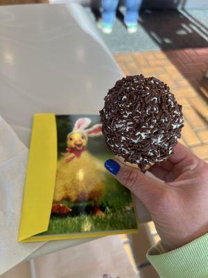 An Easter greeting card and a baby-sized cone with banana soft serve and chocolate sprinkles.