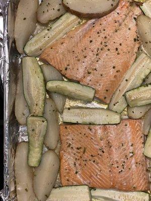 Sheet pan supper of their coho salmon, potatoes, zucchini in garlic lemon butter sauce