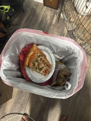 A nasty tasteless pizza that we got ripped off for it also has mushrooms on it and its in the trash can after on bite