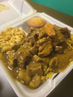 Goat curry w/ yellow rice, mac&cheese, and cornbread