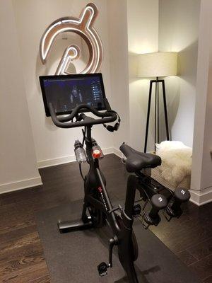 Showroom bike with logo in background.