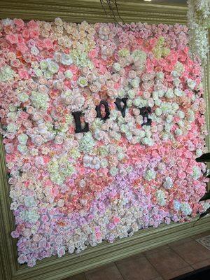 This is a floral wall, which can be made with either silk or Frey flowers. It can be custom sized and is available for rental.