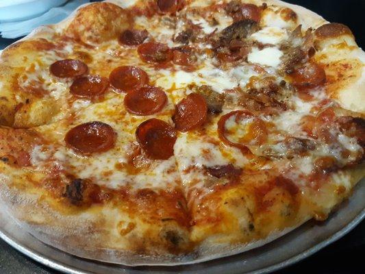 Half pepperoni and meat pizza