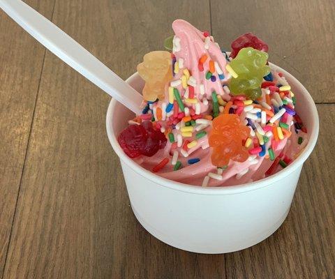 Strawberry yogurt with sprinkles and gummy bears