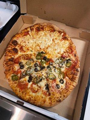 Half extra pineapple and pepperoni and half pepperoni, mushroom, jalapeño, and black olives! Perfectly done!