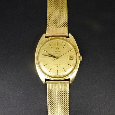 18k Omega Constellation w/date automatic, 14k strap AND black leather strap as option. Circa 1960's, see hhorwitz.com to purchase