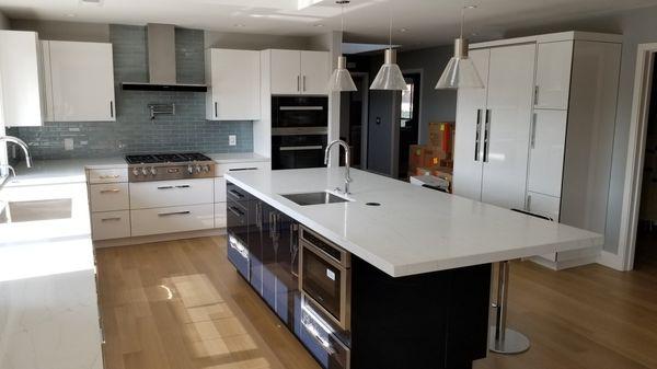 High gloss acrylic cabinets with quartz counters