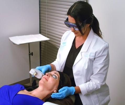 Candy, our Nurse Laser Specialist, with a patient.