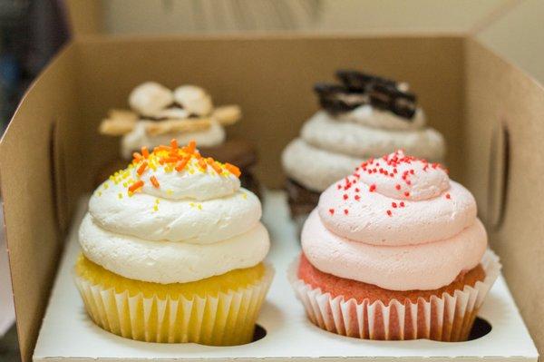 Front: Lemon Guava Cupcake, Very Berry Strawberry Cupcake Back: S'mores Cupcake, Chocolate with Oreo Mousse Cupcake