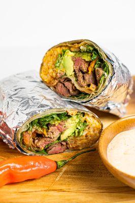 Enjoy our Lomo Saltado Burrito. Juicy strips of beef sirloin tossed with sauteed onions and yellow chili.