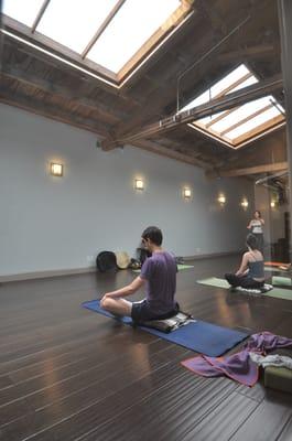 The light-filled yoga studio