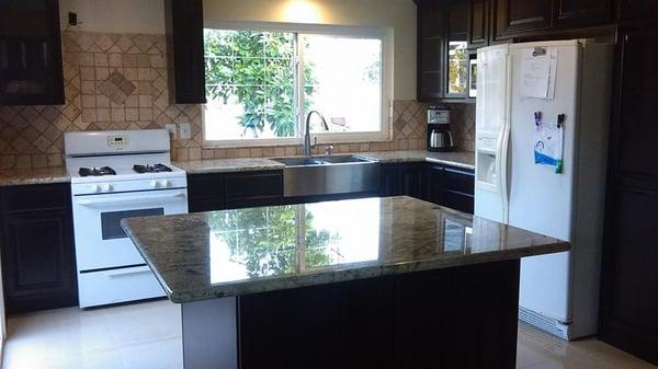 Kitchen we finished in Upland CA. Cabinets, Granite, Porcelain Floors, and Travertine backsplash