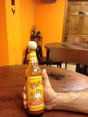 Now THATS a bottle of cholula, 12 oz of yummy Mexican hot-sauce right at your fingertips.