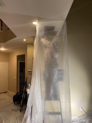 Moisture testing and tearing out the wet drywall..