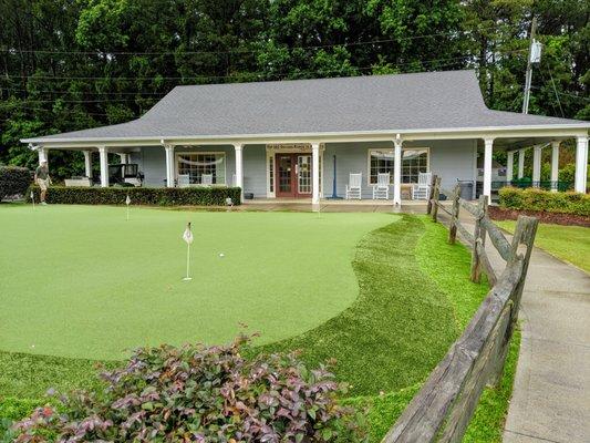 Outside the clubhouse. Practice putting green.