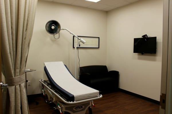 Our inviting patient suites have flat screen TVs and a sofa.