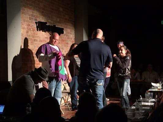 One hypnotized audience member who can't explain why he's wearing g a Barney costume at Shawn Paulsen's sold out show