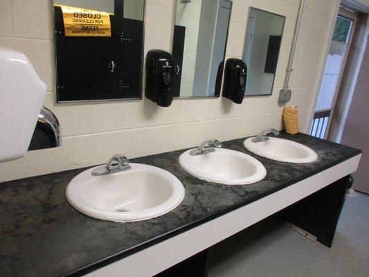 communal sink area messy from use no paper towels for clean up