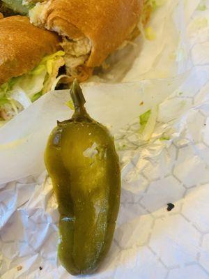 Stem on the jalapeño and there wasn't supposed to be any jalapeños on my torta . There were several