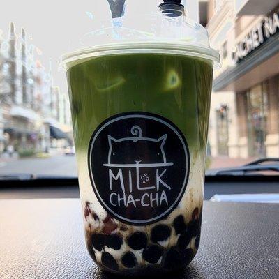 Matcha milk tea with boba and red beans.