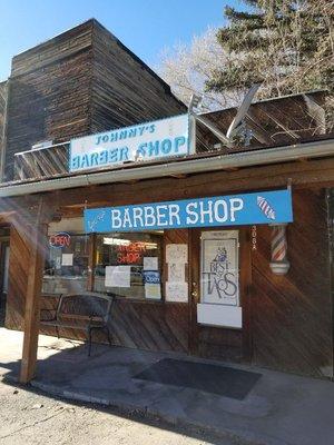 Located just south of Smith's grocery store; JOHNNYS BARBERSHOP