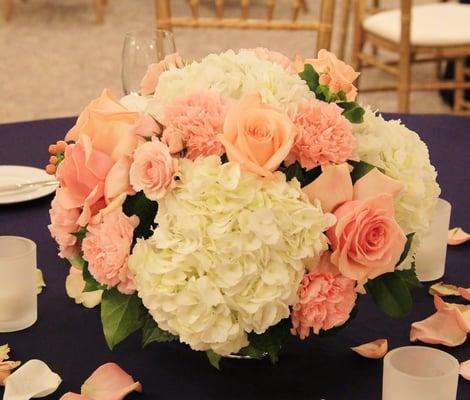 Low lying arrangement from our wedding with engagement roses, white hydrangeas, eucalyptus, hypericum berries and pink carnations