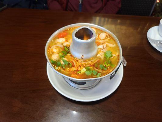 Tom Yum soup. Served boiling hot and awesome flavor!