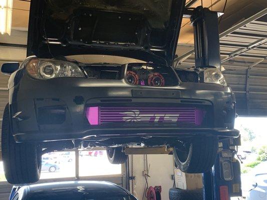 New bumper, cut to fit the front mount intercooler; color-matched before final installation.