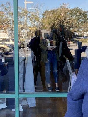 Employee holding Starbucks with other employees, no mask! So the policy only applies to shoppers?