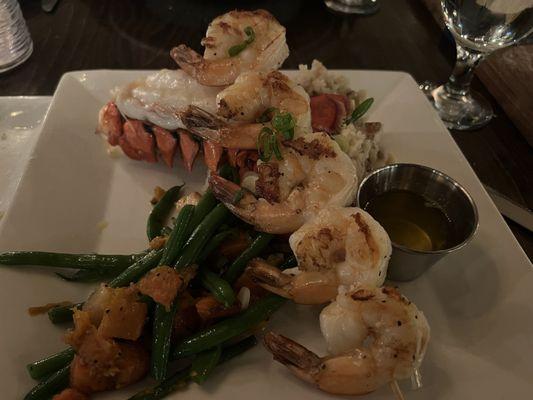 Surf & Surf. Maine lobster tail and grilled shrimp skewer with mashed potatoes and vegetable medley.