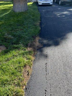 Again, cutting back to the original size of the driveway with some nice beading of water from the morning sprinklers!