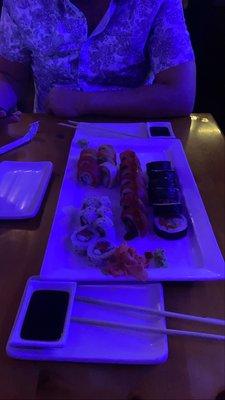 Spicy tuna roll (bottom left), Rainbow roll with Alaskan snow crab (top left) Red Hot Chili Peppers roll (middle), Sushi Rock roll (right).