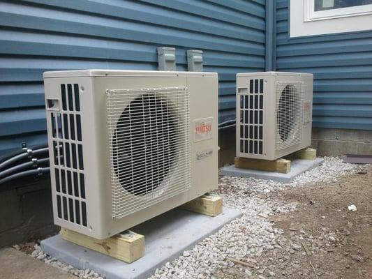 Outdoor portion of 2 multizone ductless / minisplit cooling and heating systems