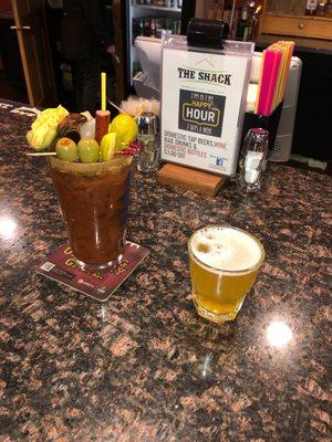 An awesome big bloody! The Shack is known for that. On the right is a chaser of Spotted Cow.