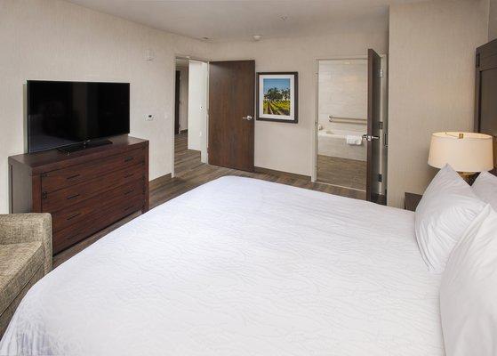 Our King 1 Bedroom Suite features all the amenities of a standard room plus a separate living room area, wet bar and 1.5 bathrooms.