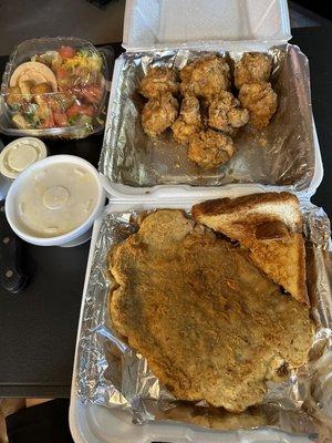 Chicken Fried Steak with fried mushrooms, mash & a side salad .