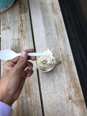 my gorgeous tan hand, the edge of my beautiful lavender sweater, a spoon, and some delicious ice cream.