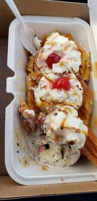 Churro split with cookies and cream, strawberry, vanilla ice cream