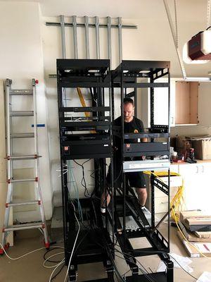 Tom is installing our WattBox power supplies to our 40AMP rack service all powered primarily by Solar.