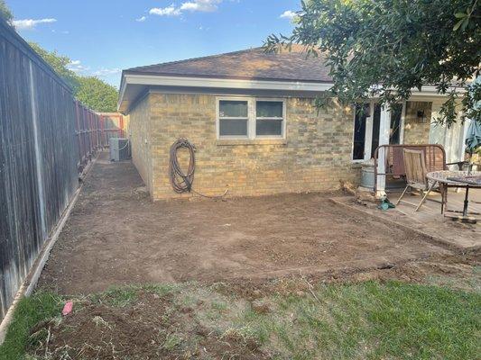 Before-Extending patio area to create a bigger outdoor living space.