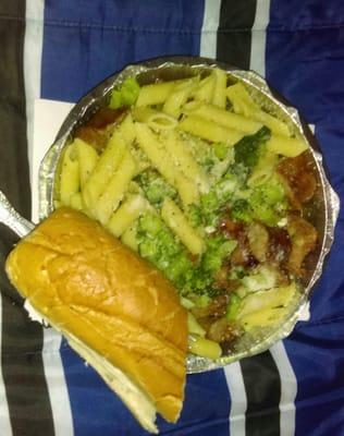 Rigatoni with broccoli , sausage and garlic and olive oil sauce with the bread on the side