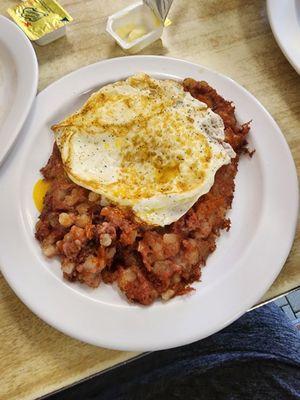 Corn beef hash with an overeasy eight