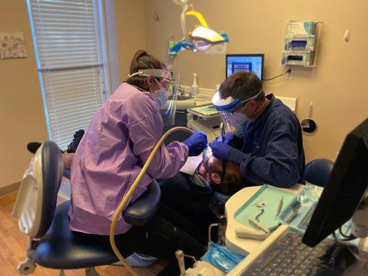 Dr. Ranzinger at work with dental assistant