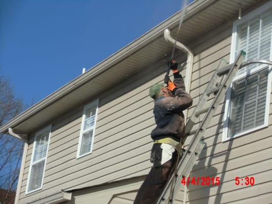 He removes all the dingy 'gray' from the gutters.