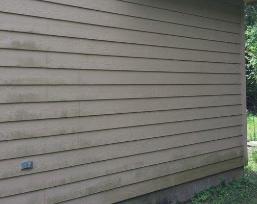 Before picture of dirty house siding.