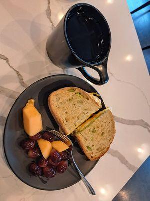 Breakfast sandwich with avocado, cup of the Winter blend