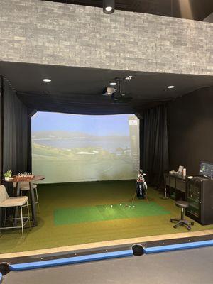 Complete golf simulator with other gaming options.