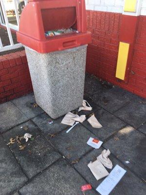 Trash overflowing in the play area outside