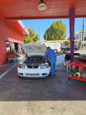 There's a photo of Jose working on my car doing an excellent job.